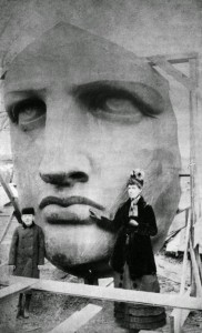 People posing next to the Statue of Liberty as it’s unpacked, 1886